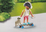 SKATEBOARDER WITH DOG